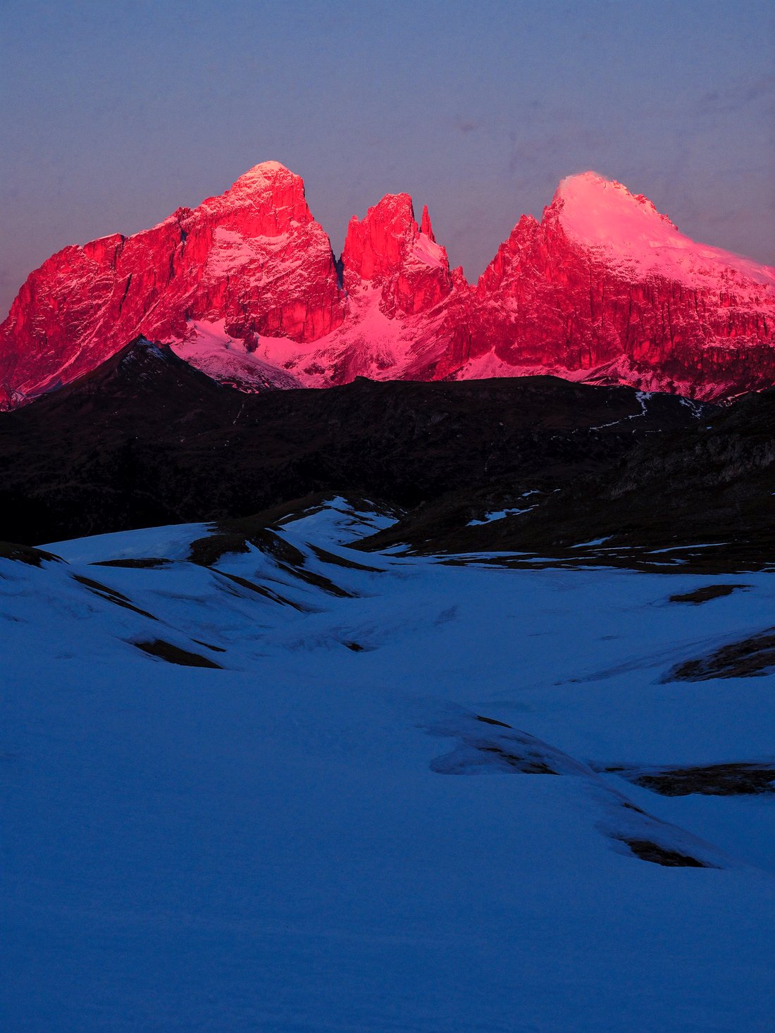 The Dolomite spires glowing pink at dawn