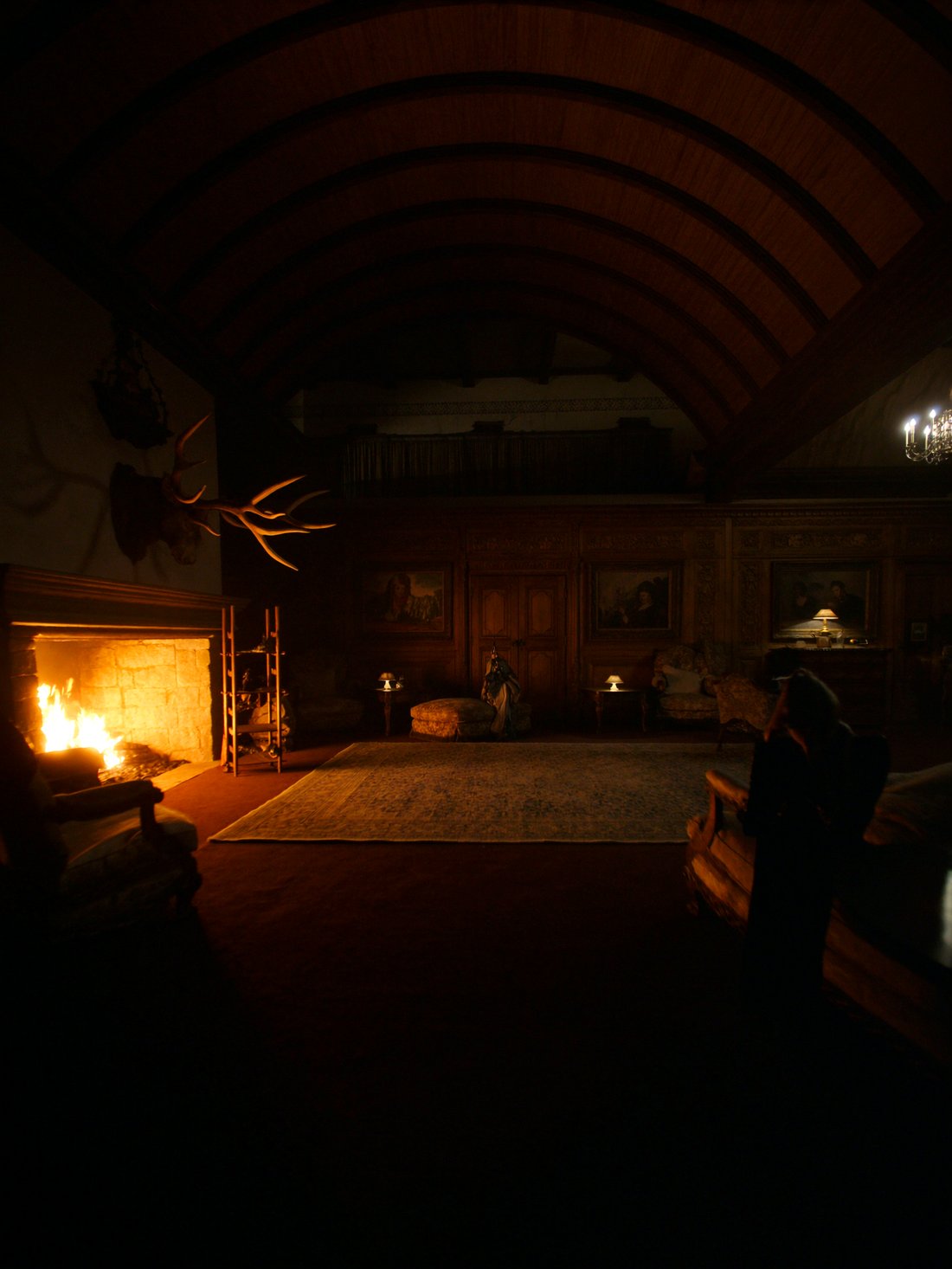 A grand family-run Lech hotel lounge by firelight