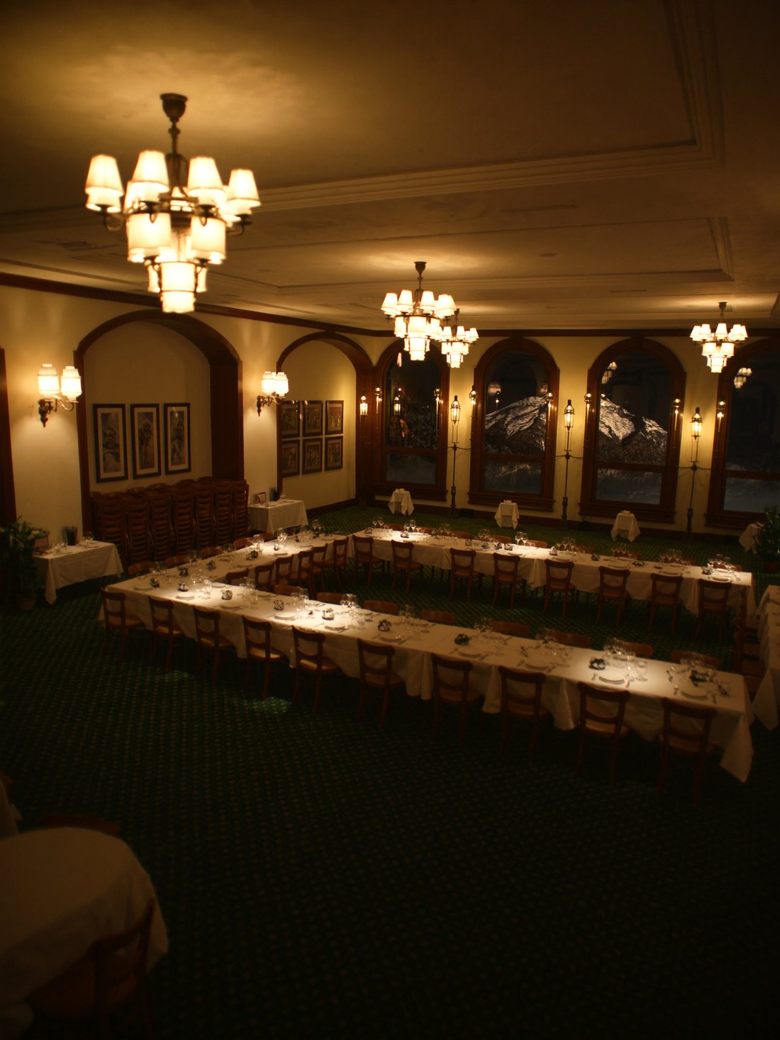 The grand dining room of Hotel Portillo at night