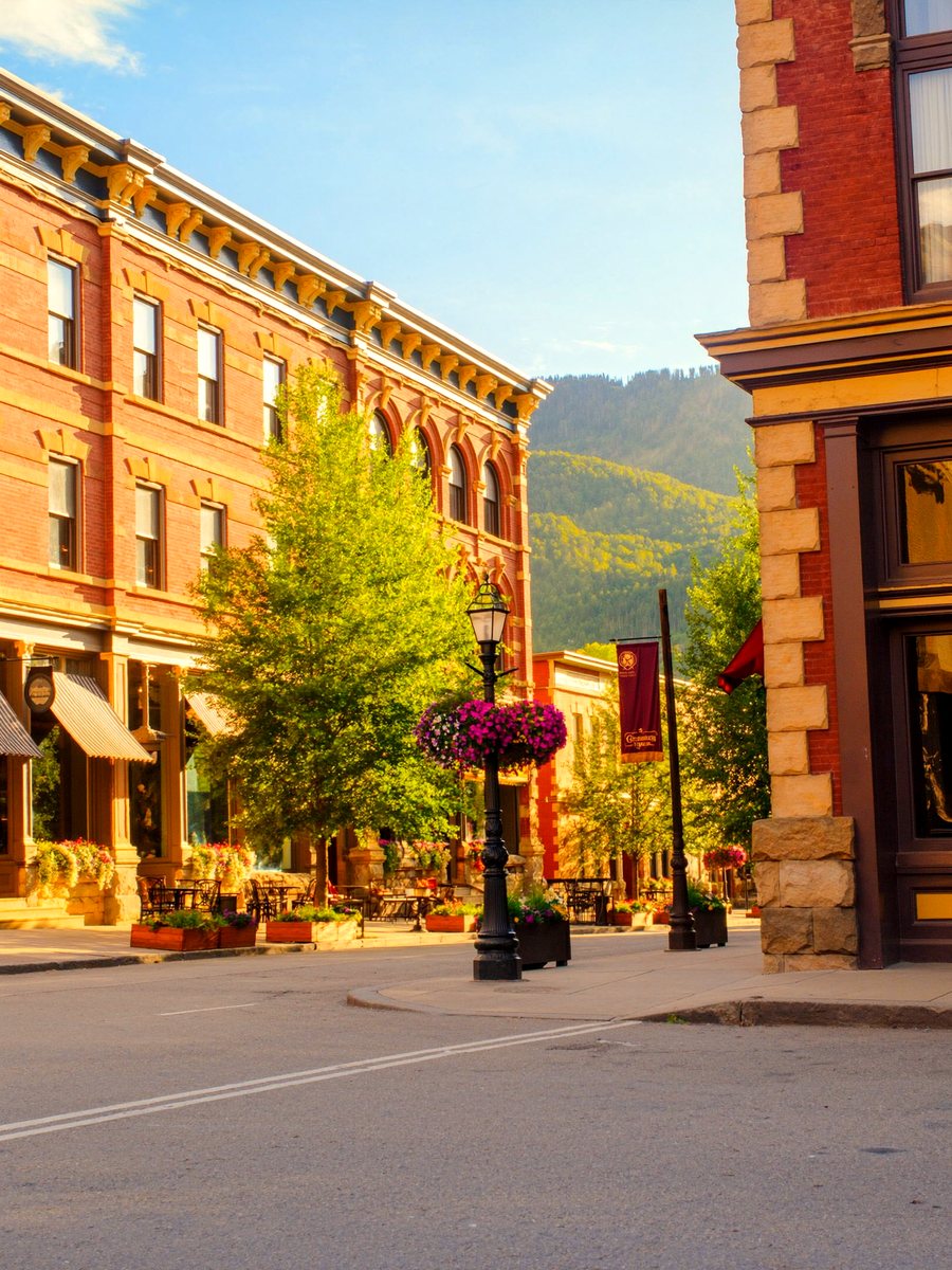 Aspen&rsquo;s historic Victorian Main Street in summer, lined with flowers