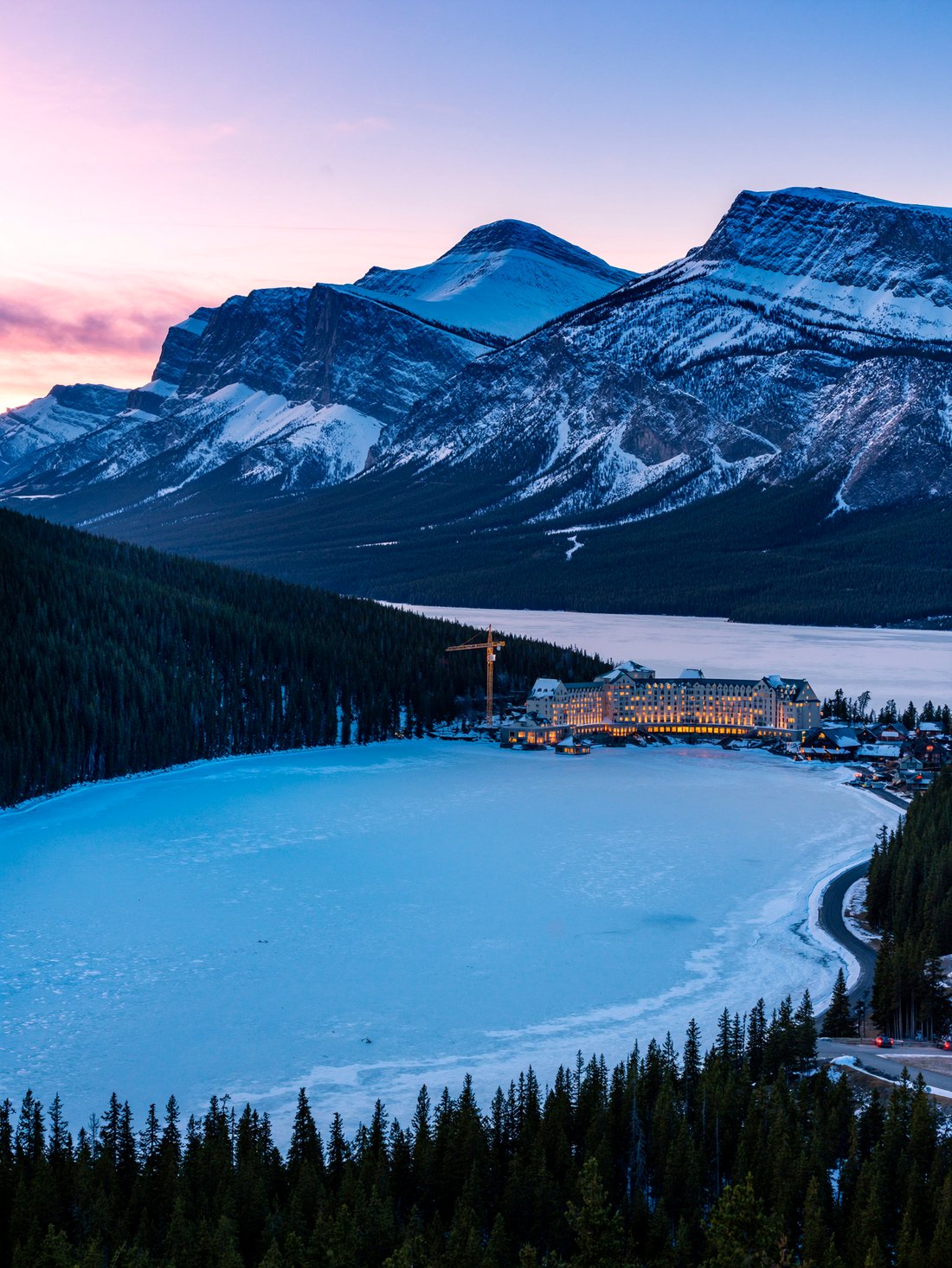 A grand chateau hotel above a frozen lake in Banff