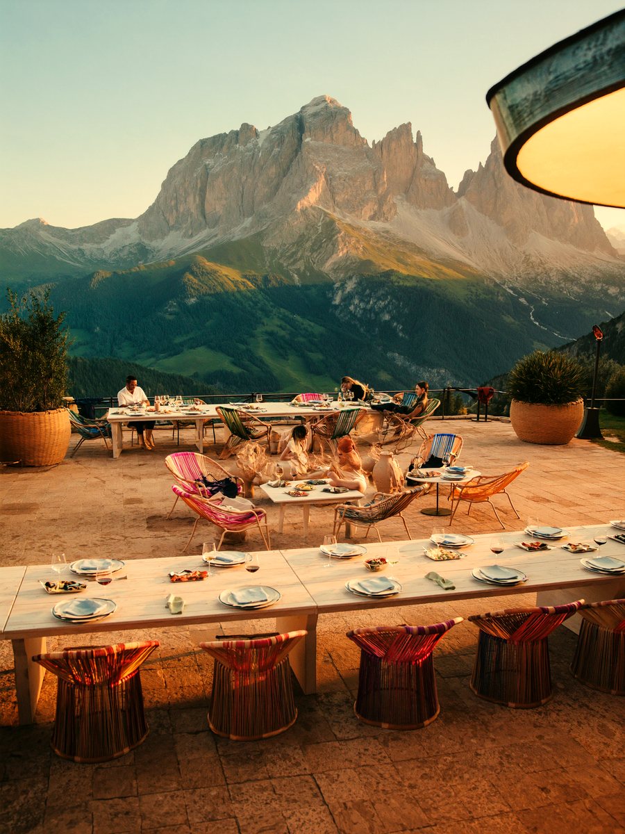 A long sun-terrace lunch beneath the Cortina Dolomites at golden hour