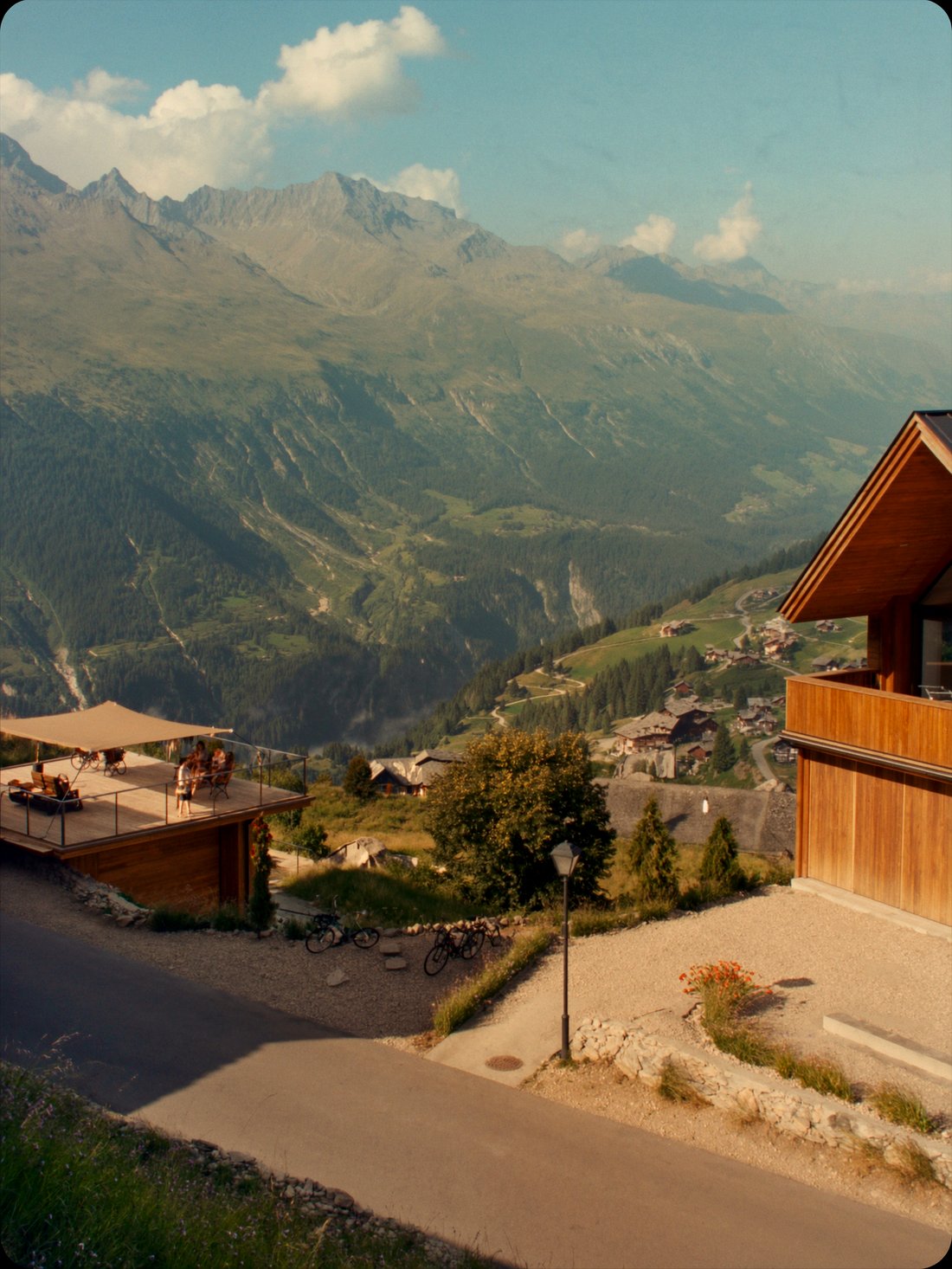 Verbier's chalets and valley in summer green