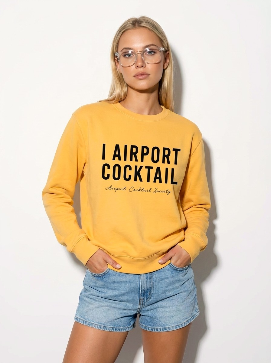 A model wearing the gold I Airport Cocktail crewneck