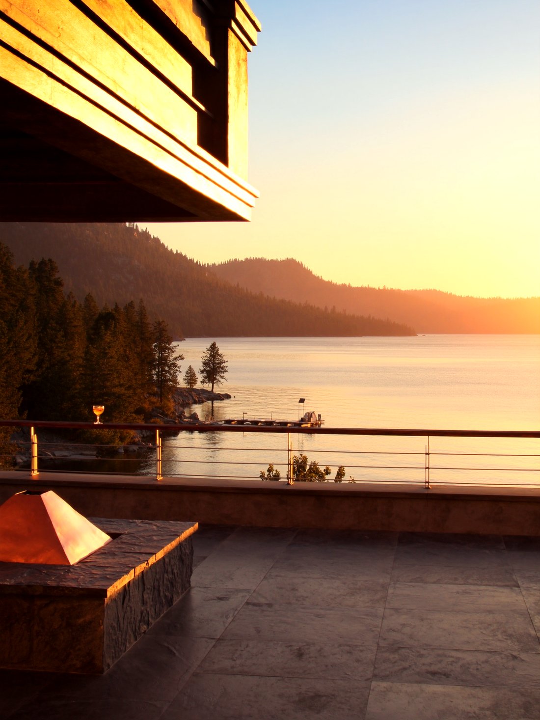 A lakeside lodge terrace at golden hour in Tahoe